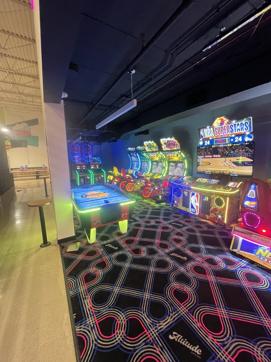 Arcade games and ceiling lighting in the Altitude Chicago arcade area.