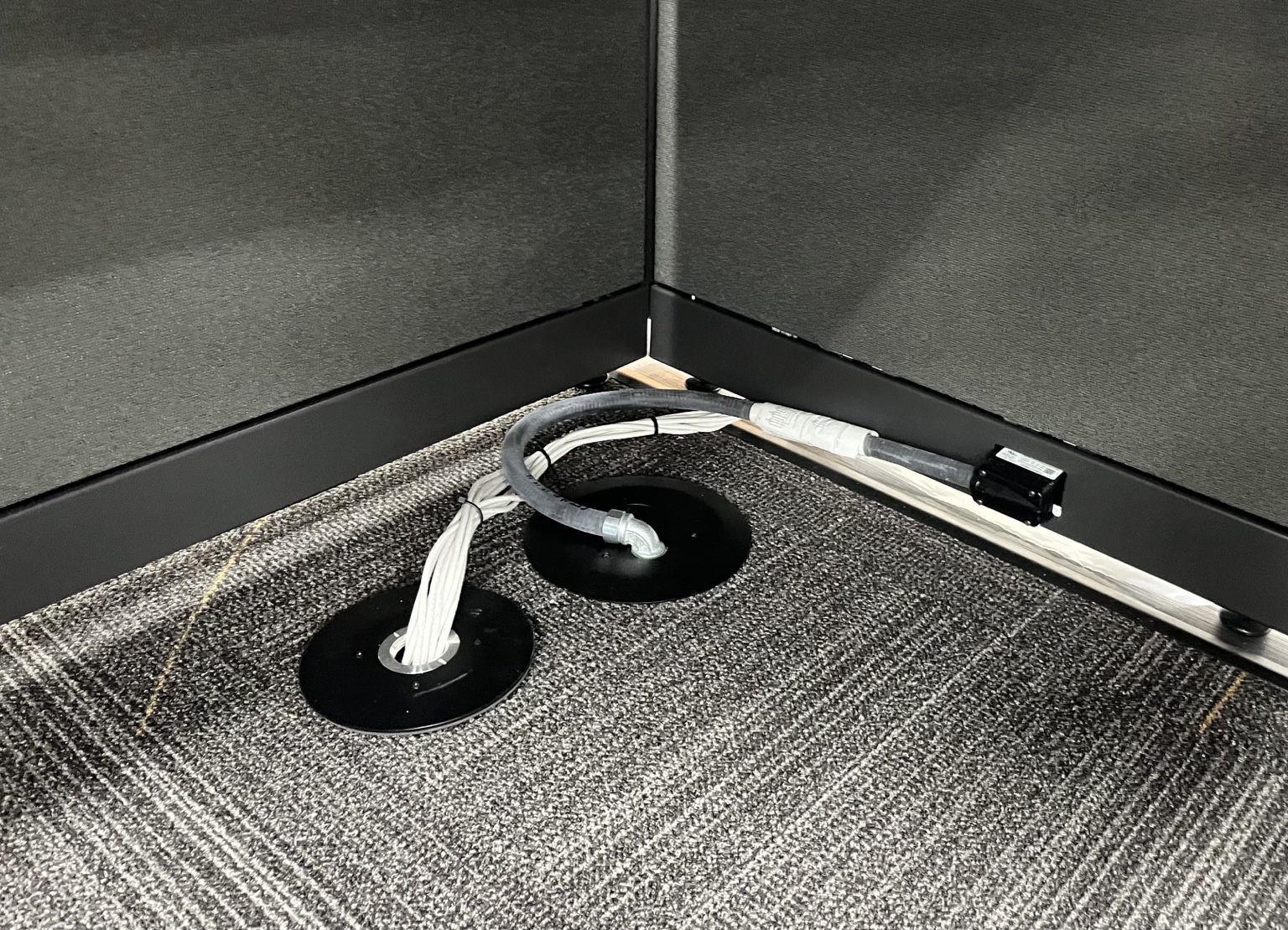 Floor-fed electrical connection serving the new office furniture at Crown Lift Trucks.