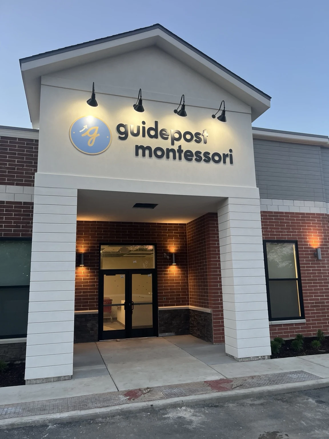 Illuminated Guidepost Montessori entrance and sign at the original Vernon Hills project.