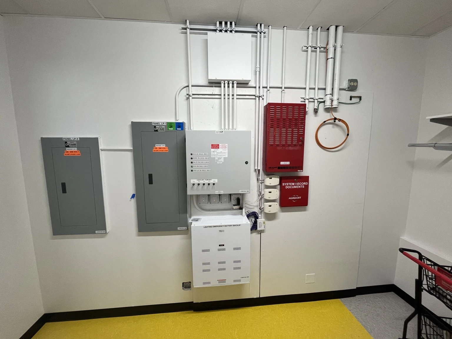 Electrical panels, lighting controls and remote emergency lighting battery backup at J.Crew Factory.