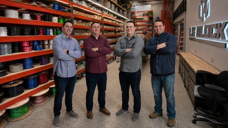 Greg, Jon, Danny, and Tom Block in the LH Block Electric warehouse.
