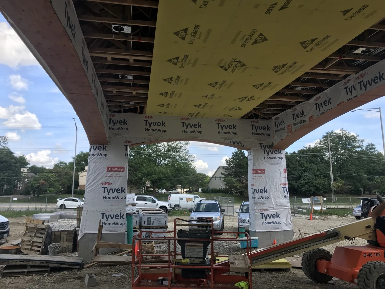 Recessed lighting rough-in beneath the covered entrance.