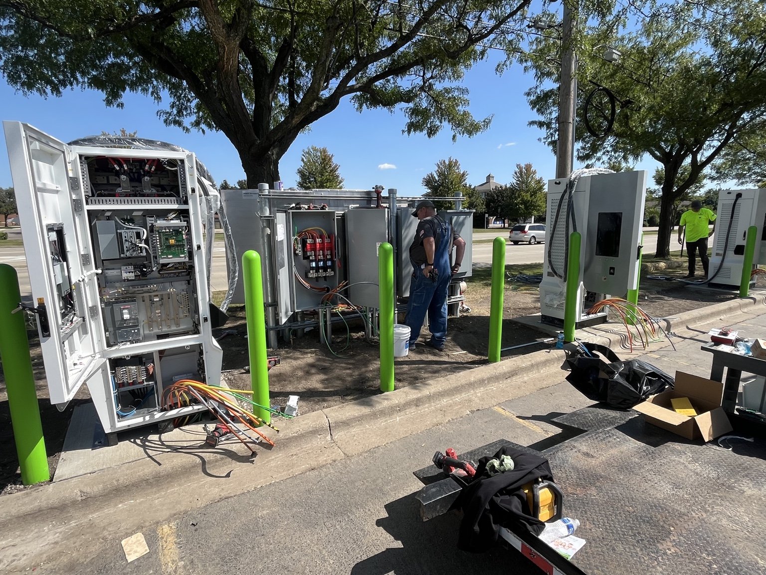 Open EV charging cabinets and installation work at the Naperville site.