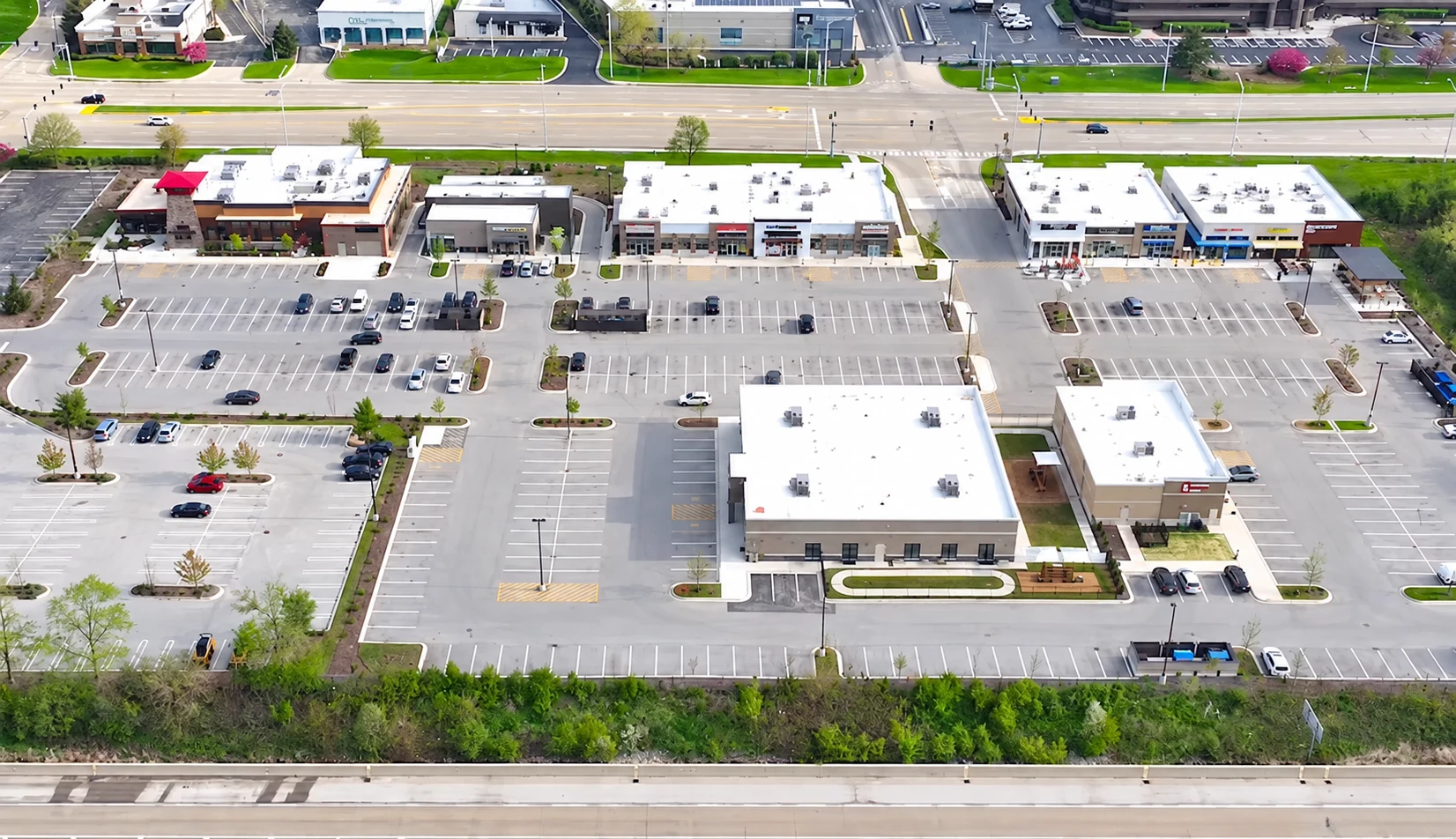 Aerial view of commercial buildings, parking areas, and access roads at The Overlook at Oakbrook.
