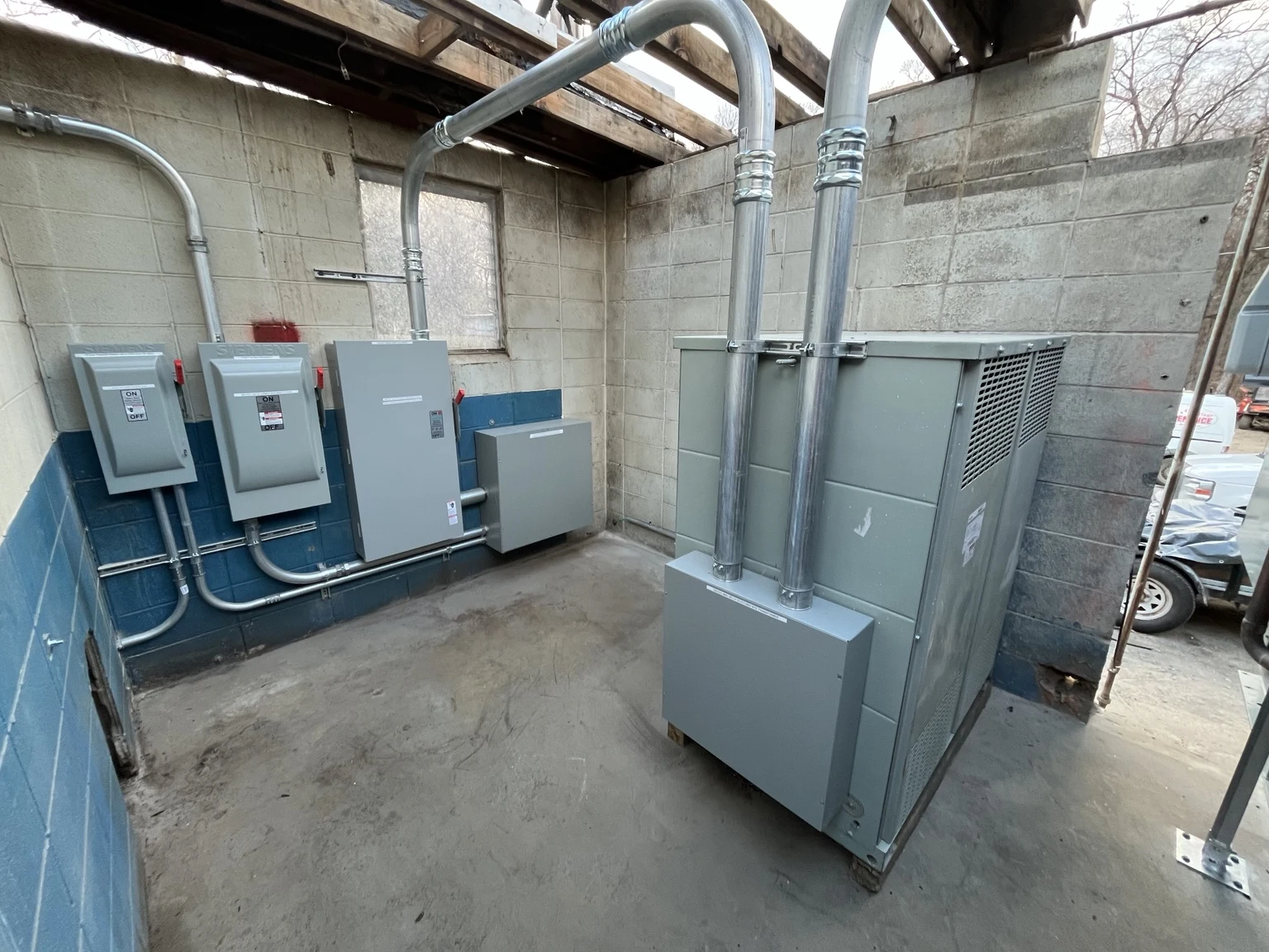 Transformer, disconnects and electrical conduit at Santa’s Village Polar Dome.