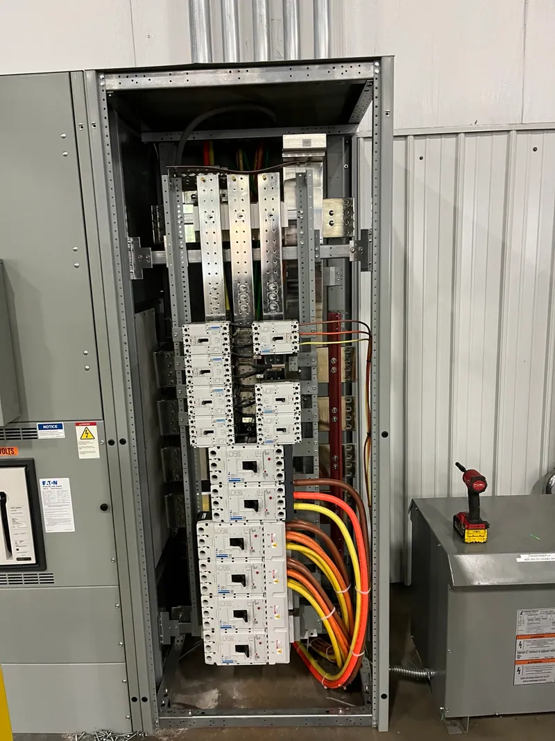 Distribution breakers and outgoing feeder conductors during installation.