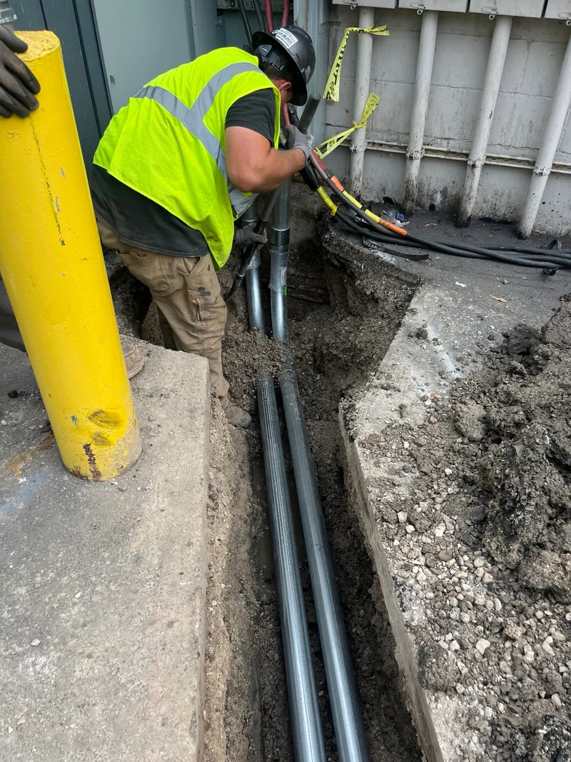 Work at the building end of the new underground service conduits.