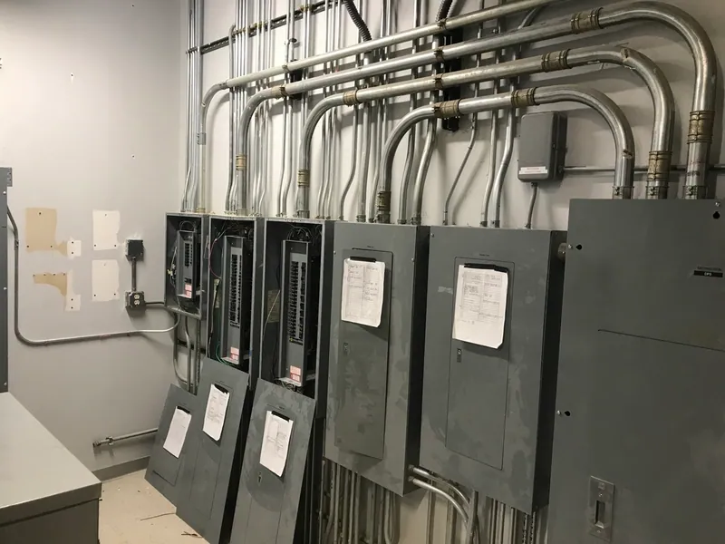 Rerouting circuits within existing electrical equipment during the facility renovation.