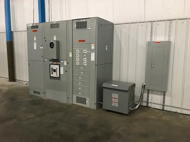 New 3,000-amp electrical service switchboard with the adjacent transformer and panelboard at Eco Plastics in Rockford.