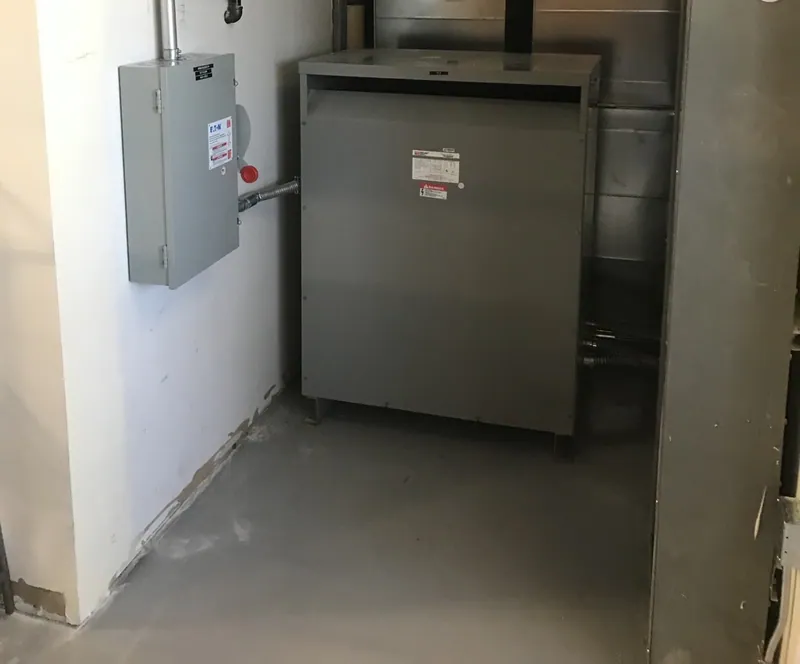 Transformer and disconnect installed for an incoming injection molding machine.