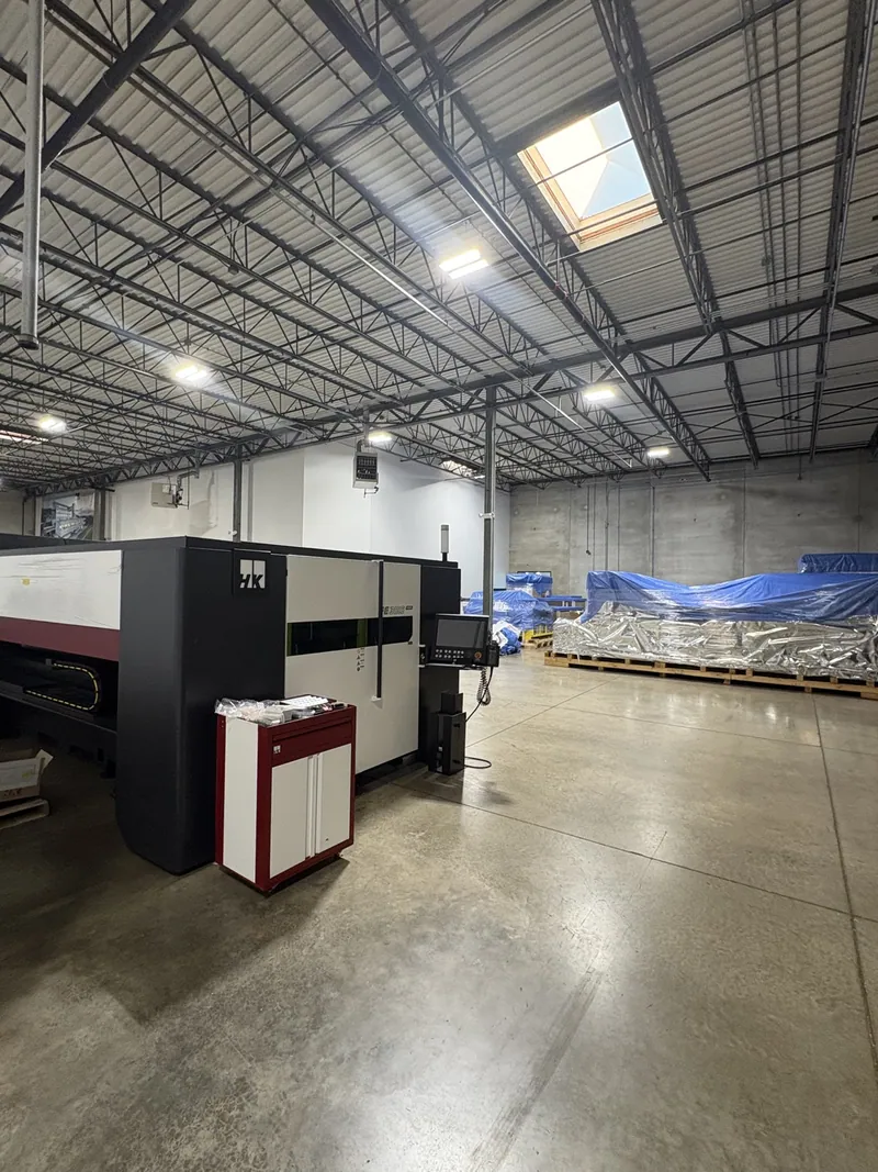 LED high-bay lighting and laser-cutting machinery at HK Laser’s Bartlett facility