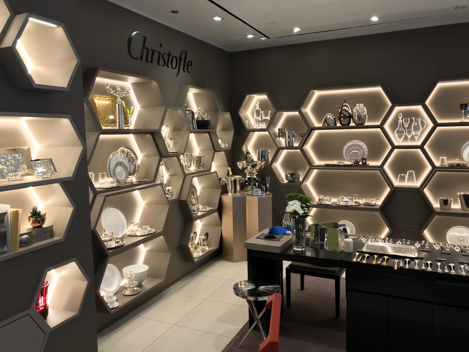 Illuminated hexagonal display shelves at Christofle in Chicago.