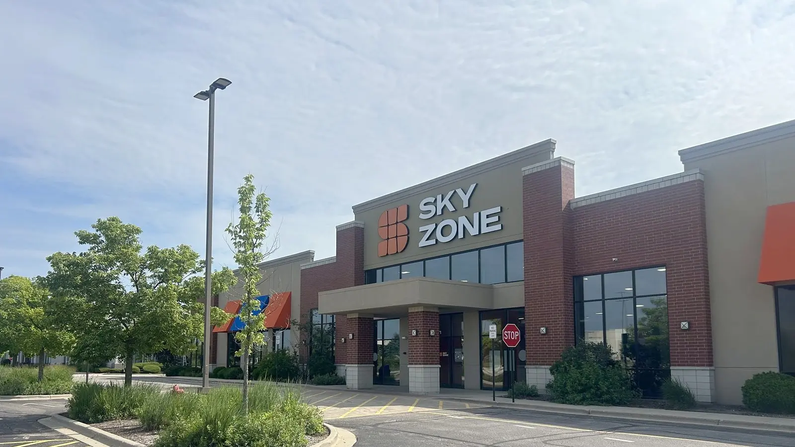 Sky Zone Trampoline Park exterior and parking area in Algonquin.