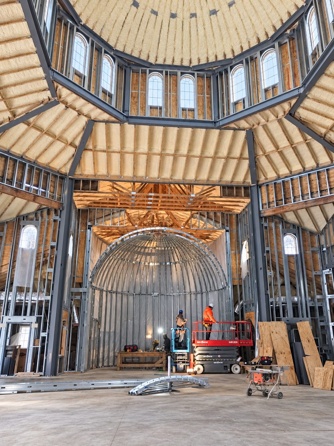 Interior framing and lift equipment beneath the dome at St. Sophia Greek Orthodox Church in Elgin.