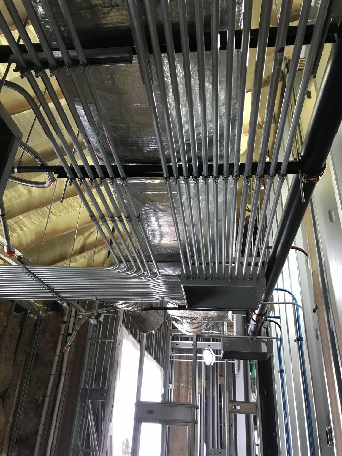 Parallel overhead electrical conduits at the St. Sophia church project.